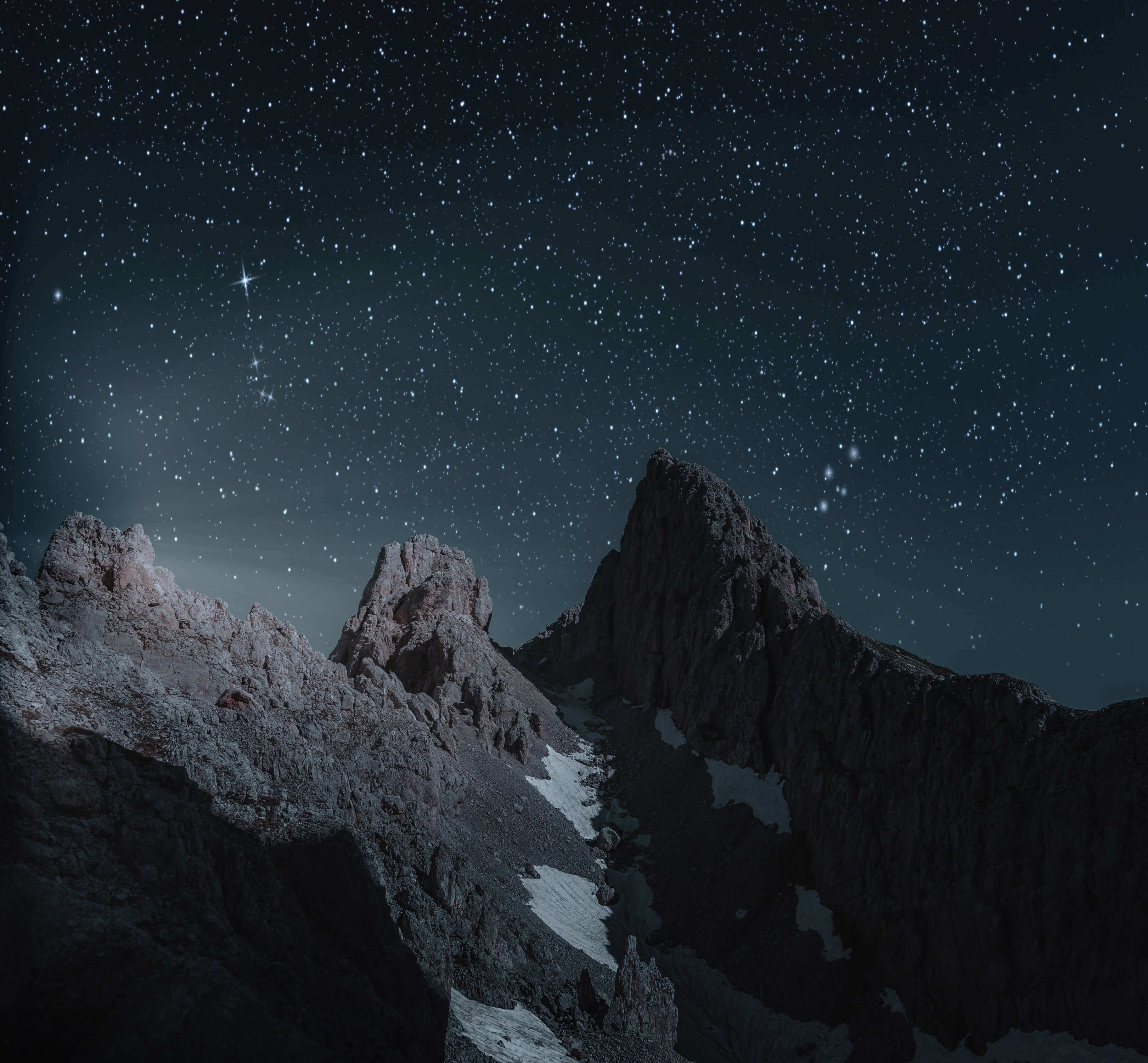 Mountain landscape beneath a clear night sky